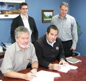 Signing a contract to come up with a sustainable business model for the Tairawhiti Navigations project is business analyst Duncan McIntosh and Director Deryck Shaw from APR Consultants (rear) Council Chief Executive Lindsay McKenzie and Karl Johnstone act